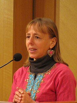 medea benjamin speaking at a microphone